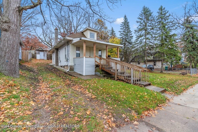 view of front of house featuring a front yard and a porch