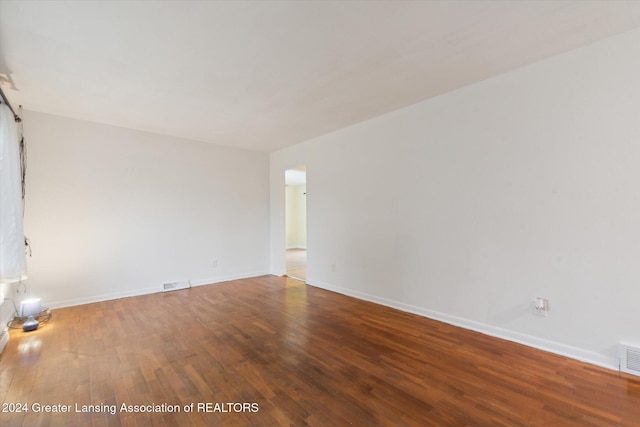 unfurnished room featuring wood-type flooring