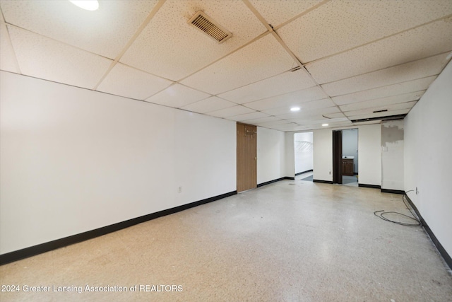 basement featuring a drop ceiling