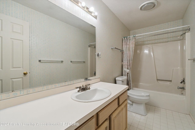 full bathroom with tile patterned floors, vanity, toilet, and shower / bath combo with shower curtain