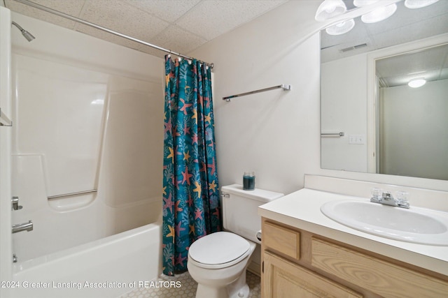 full bathroom featuring vanity, shower / bath combo, and toilet