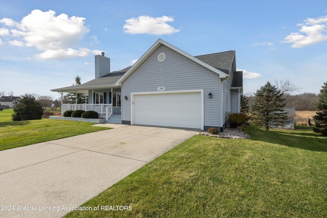 view of front facade featuring a front yard, a porch, and a garage