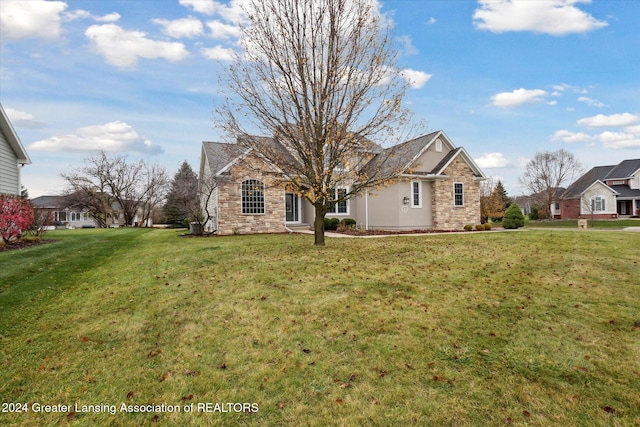 rear view of house with a yard