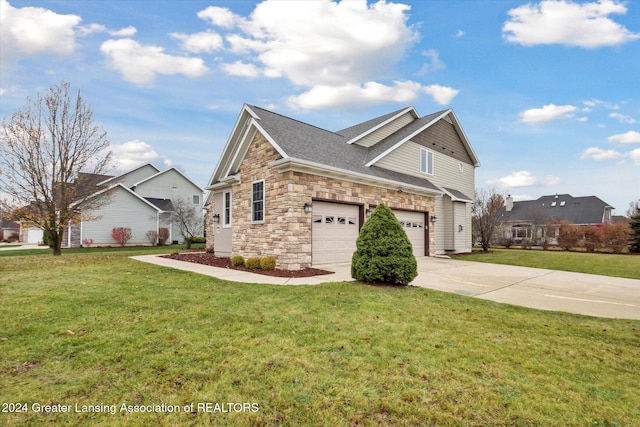 view of front of home with a front lawn and a garage