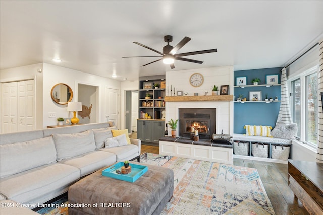 living room featuring ceiling fan and wood-type flooring