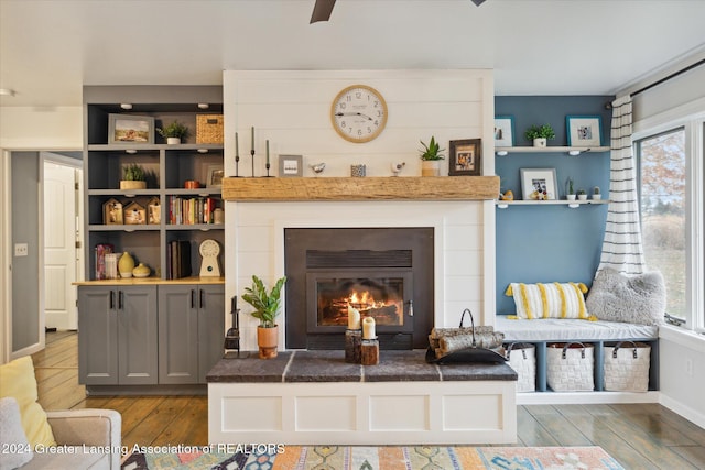 living room featuring hardwood / wood-style flooring and a healthy amount of sunlight