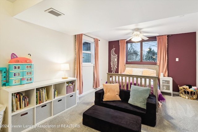 carpeted bedroom with ceiling fan