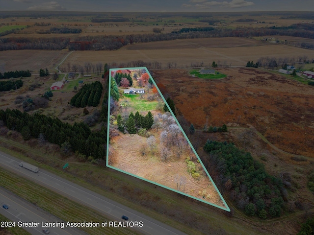 birds eye view of property with a rural view