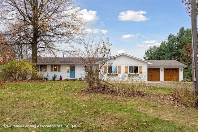 ranch-style house with a front yard and a garage