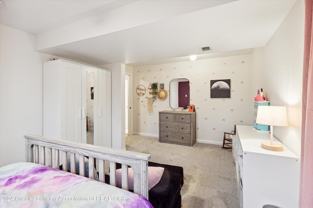 bedroom featuring light colored carpet