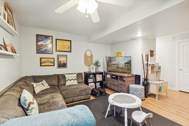 living room with hardwood / wood-style floors and ceiling fan