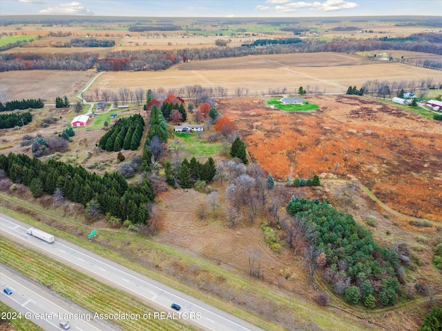 birds eye view of property with a rural view