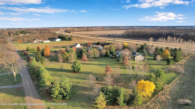 birds eye view of property featuring a rural view