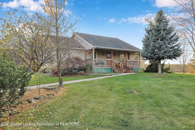 view of front of property with covered porch and a front yard