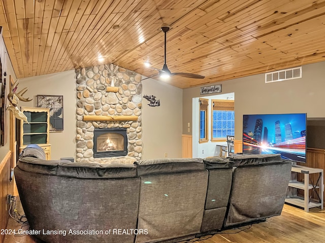 living room with wood ceiling, vaulted ceiling, ceiling fan, hardwood / wood-style flooring, and a fireplace