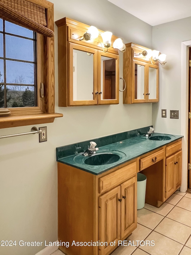 bathroom with tile patterned flooring and vanity