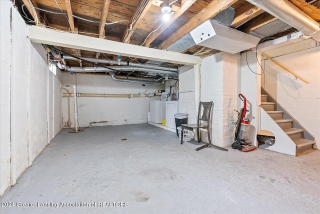 basement featuring washing machine and dryer