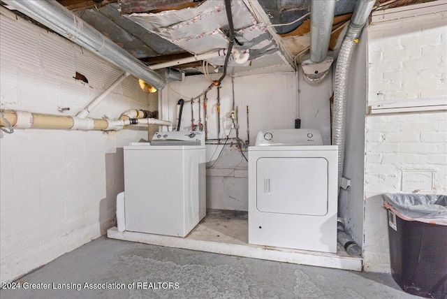 laundry area with washing machine and clothes dryer