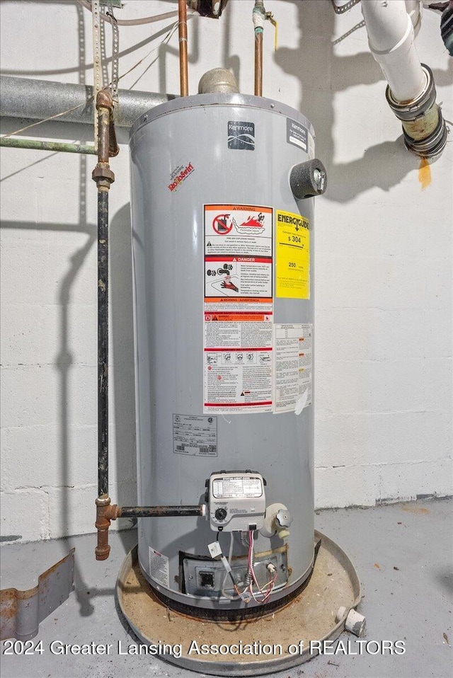 utility room featuring gas water heater