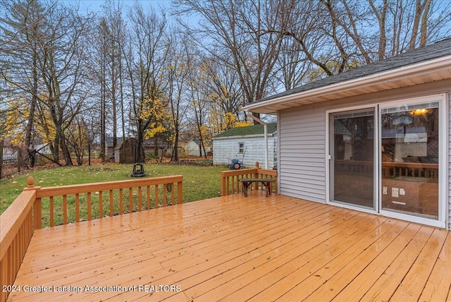 wooden terrace with a yard