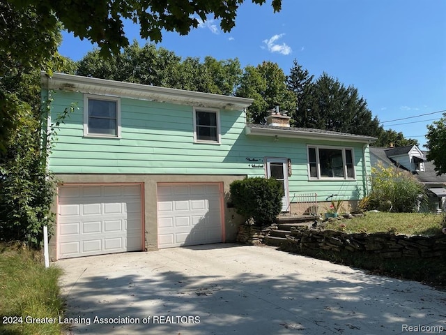 split level home with a garage