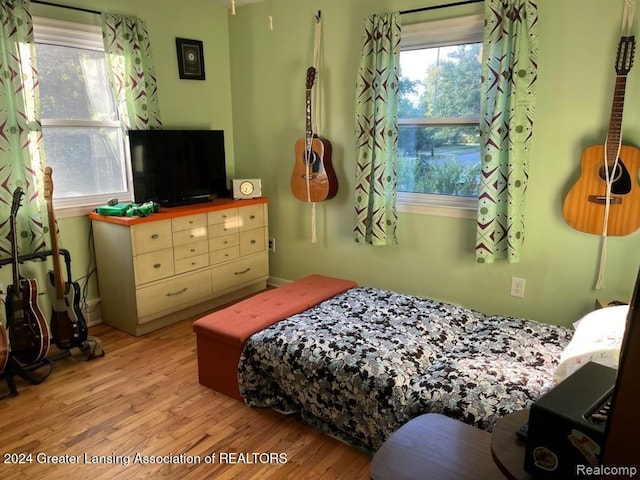 bedroom with light wood-type flooring