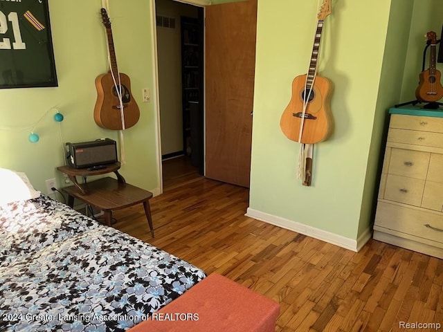 bedroom featuring hardwood / wood-style flooring