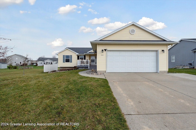 view of front of house with a garage and a front yard