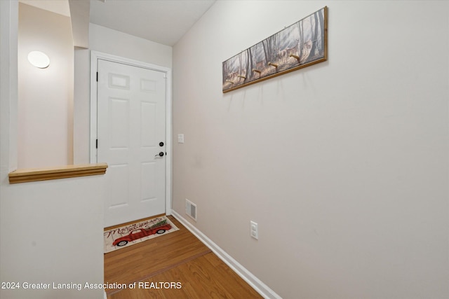 doorway to outside featuring hardwood / wood-style flooring