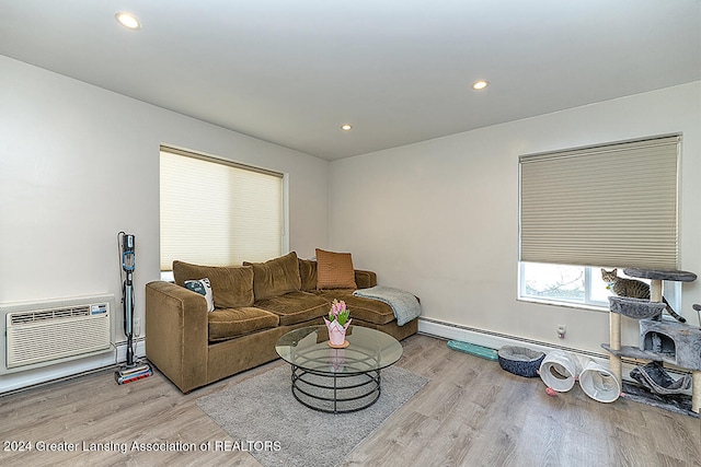 living room with light wood-type flooring and a wall mounted AC