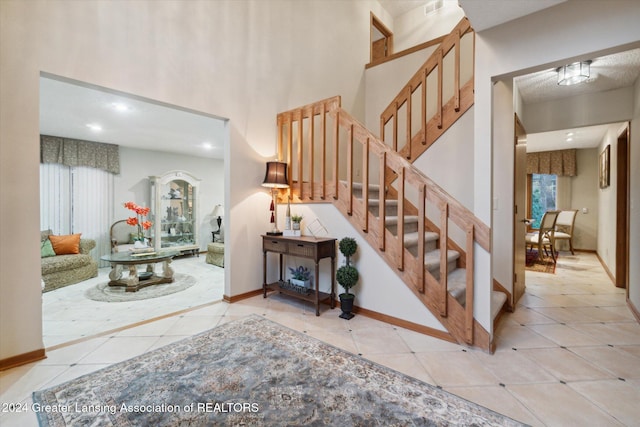 stairs with tile patterned floors