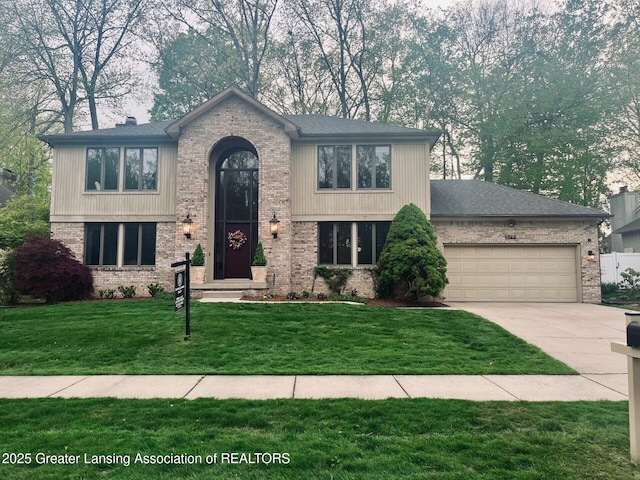 5791 Westminster Way E, Lansing, MI 48823 - view of front of home with concrete driveway, brick siding, a garage, and a front yard