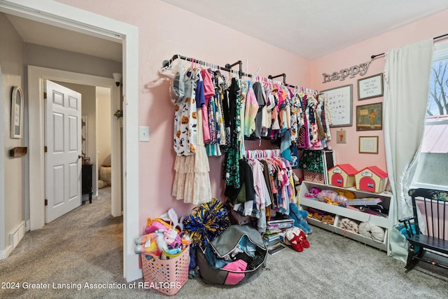 spacious closet featuring carpet flooring