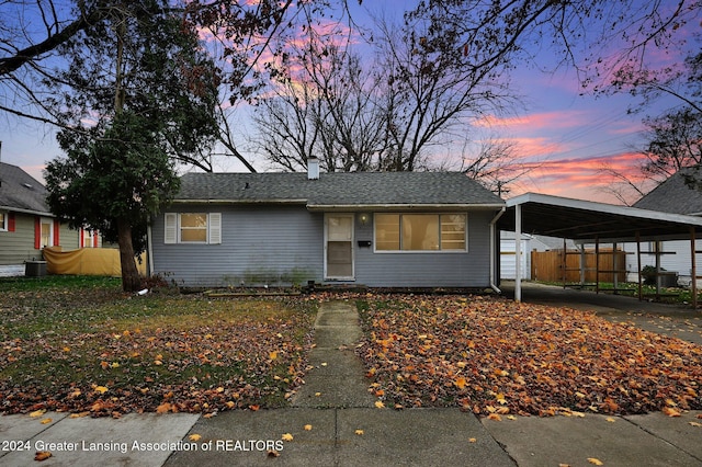 ranch-style house with a carport