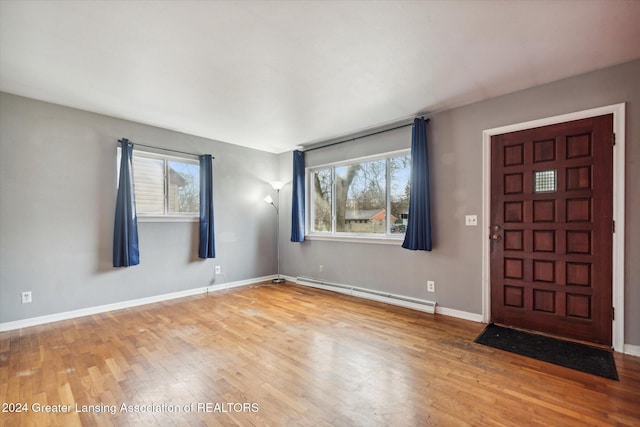 entryway featuring light hardwood / wood-style floors and a baseboard radiator