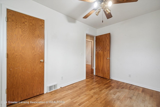 spare room featuring light hardwood / wood-style flooring and ceiling fan