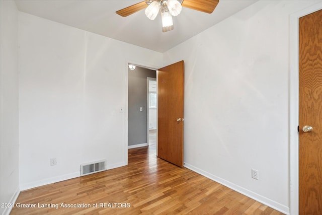 spare room featuring ceiling fan and light wood-type flooring