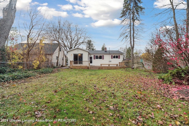 exterior space with a front yard and a deck