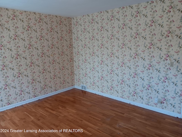 empty room featuring wood-type flooring