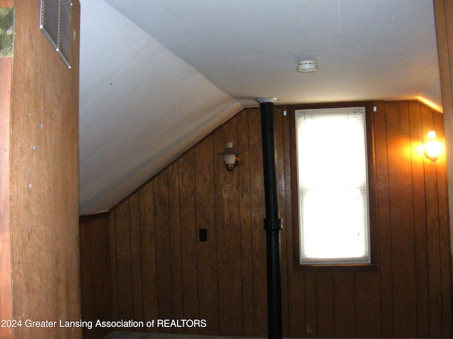 interior space featuring wood walls