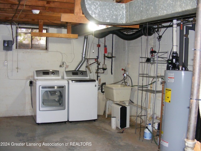 washroom with separate washer and dryer, water heater, and sink