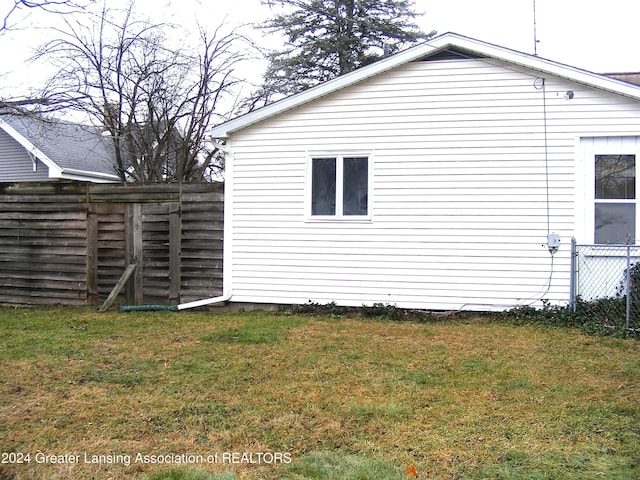 view of home's exterior featuring a lawn