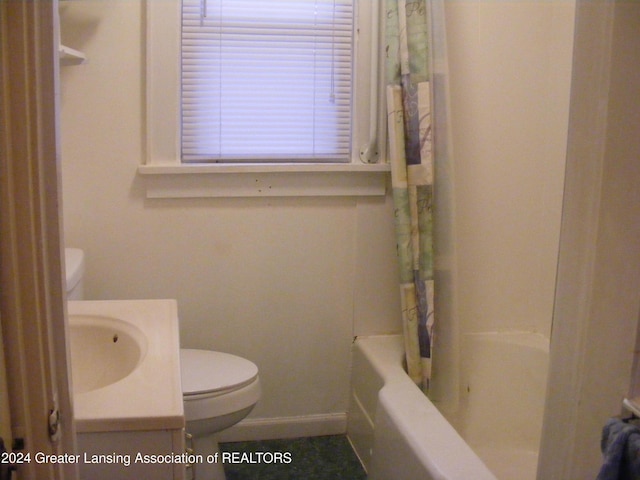 full bathroom featuring shower / bath combo, vanity, and toilet