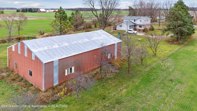 birds eye view of property with a rural view