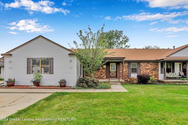 ranch-style home with a front lawn