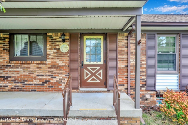 doorway to property featuring a porch