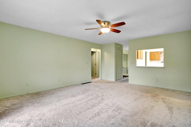 carpeted empty room with ceiling fan