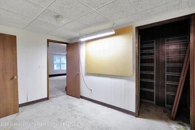 empty room featuring a paneled ceiling