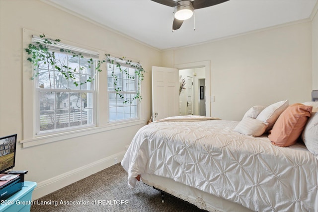 bedroom featuring carpet floors, ceiling fan, and crown molding