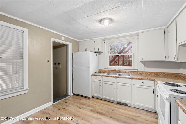 kitchen with white cabinetry, light wood-type flooring, white appliances, and sink